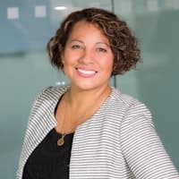 Professional woman in grey blazer